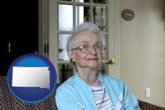 south-dakota map icon and a senior woman in an assisted living facility