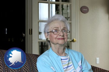 a senior woman in an assisted living facility - with Alaska icon