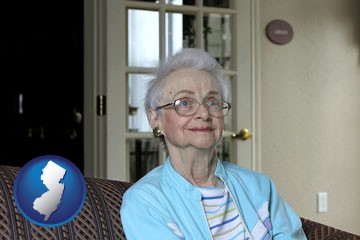 a senior woman in an assisted living facility - with New Jersey icon