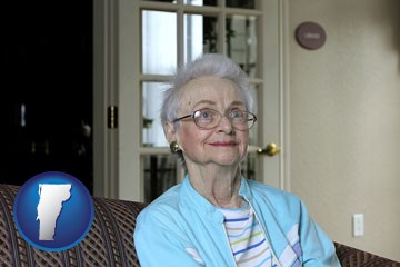 a senior woman in an assisted living facility - with Vermont icon